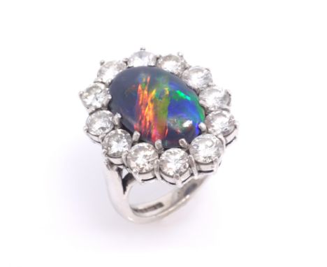 Black opal and diamond white gold cluster ring, each diamond 0.2 carat hallmarked 18ct Condition Report Black opal length 14m