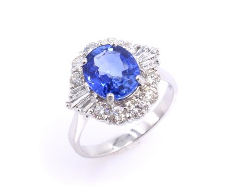 18ct white gold sapphire and diamond cluster ring, stamped 750 sapphire approx 2.1 carat diamonds approx 0.8 carat Condition 