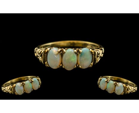 Ladies - Attractive 9ct Yellow Gold - 3 Stone Opal Set Ring, Ornate Setting, 3 Oval Shaped Opals of Good Colour, Fully Hallma