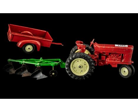 Large Vintage Die Cast Tractor with plough and large rubber wheels, make unknown, 16 inches (app.40cms) long, plus a red trai