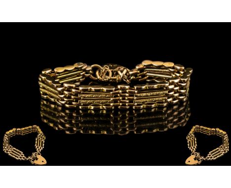 A 9ct Gold Gate Bracelet textured links, with padlock and safety chain. Hallmark 9ct, weight 16 grams. 