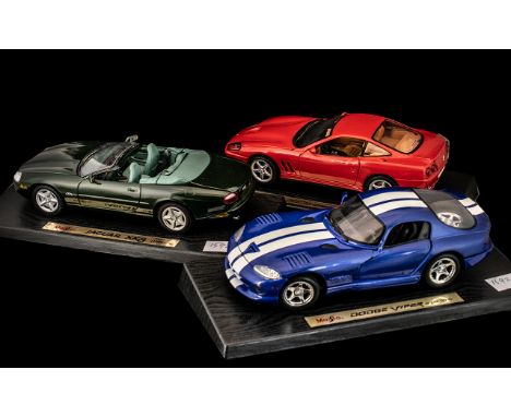 Three Maisto Model Collectors Cars on Stands, comprising Dodge Viper GTS 1996, 550 Maranello 1996, Jaguar XK8 1996.