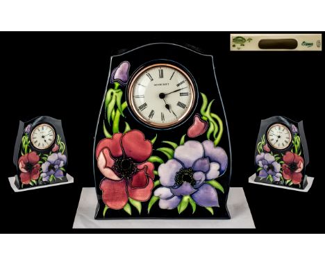 Moorcroft Large Tube lined Contemporary Mantel Clock ' Anemone Design ' On Blue Ground. Designer Walter Moorcroft. Date 2003,