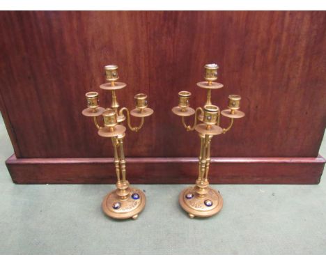 A pair of Victorian gilt brass four sconce candelabra, cabochon detail to base, 39cm high 