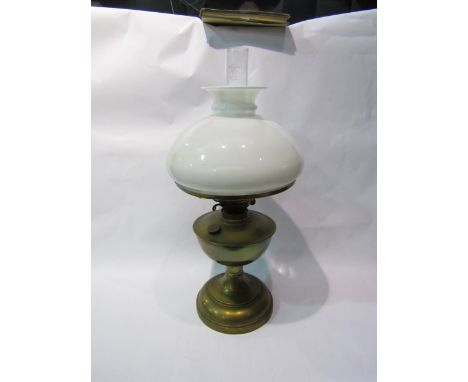 A British Made early to mid 20th Century brass oil lamp with white opaque shade 