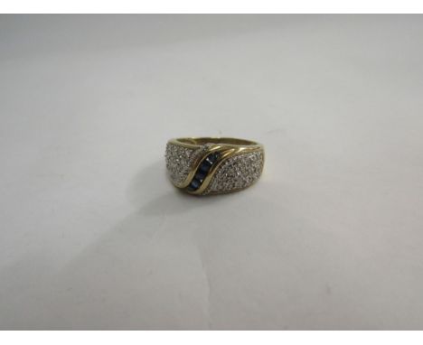 A 9ct gold diamond and sapphire cluster dress ring 