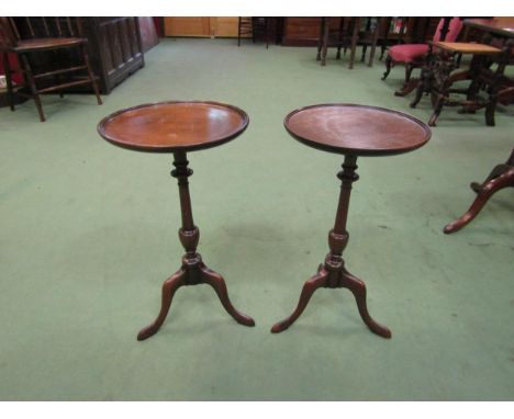 A pair of George III revival mahogany wine tables the dished circular top on a turned column and tripod base, 57cm high x 30c
