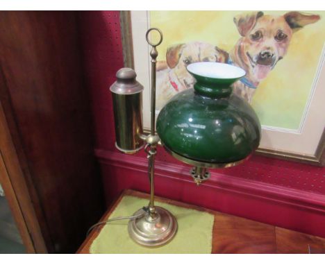 A vintage brass desk lamp with green glass shade 