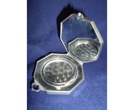 Continental silver (800 grade) early 20th C compact of octagonal form, the hinged lid with mirrored interior and powder selec