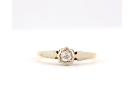 An 18ct yellow gold and platinum diamond set solitaire ring, (K).