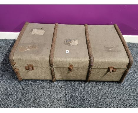 A vintage trunk, metalware contents including pairs of binoculars.