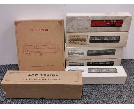 A boxed Ace trains six wheel coach set with full break van and full boxed tin plate passenger carriages.