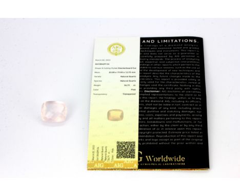 An unmounted cushion checkerboard cut natural rose quartz, approx. 36.71ct. AIG MILAN certified.