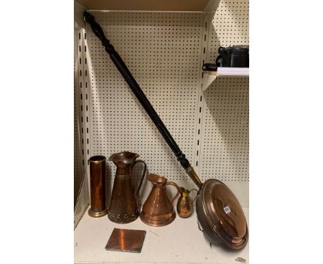 An Art Nouveau hammered copper jug and other copper items.