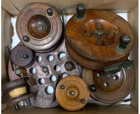 A group of vintage fishing reels.