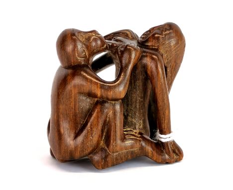 A signed carve fruitwood erotic netsuke of a woman with a monkey.