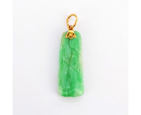 A carved jade pendant on a high carat gold bail (tested), L. 4.8cm.