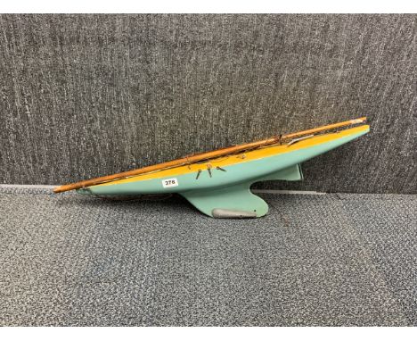 A vintage wooden model pond yacht, L. 77cm.