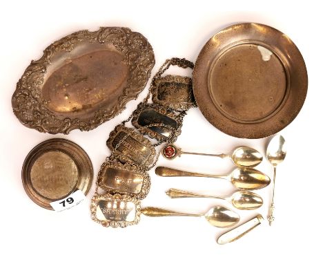 A hallmarked silver pin cushion and embossed dish with a group of five silver decanter labels and other items.