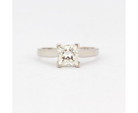 An 18ct white gold solitaire ring set with an 1.7ct princess cut diamond, colour K, clarity SI2, with WGI certificate, (O)..