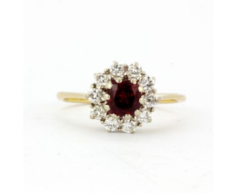 An 18ct yellow and white gold natural ruby and diamond set cluster ring, (O).