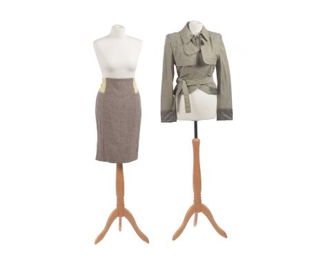 A jacket by Stella McCartney, designed as a cropped trench coat together with a tweed mid-length skirt with pale yellow waist