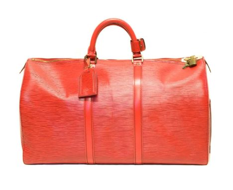 A Louis Vuitton red Epi Keepall 50 luggage bag, circa 1992, the textured red epi leather exterior with smooth leather trim, s