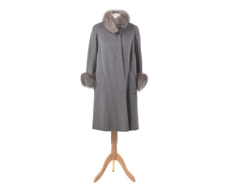 An angora wool and fur coat by Basler, the mid length grey angora wool coat with fur cuffs and collar, size 36. Condition rep