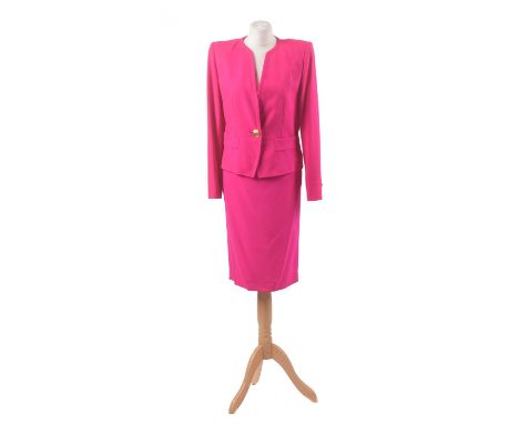 A suit by Yves Saint Laurent, the fushcia suit comprising jacket and mid-length skirt with gold button detailing, size 40 (2)