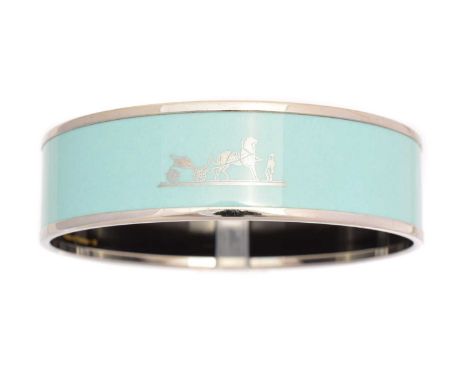 A Hermès enamel bangle bracelet, the blue enamel bangle with silver tone maker's logo and border, signed Hermès, date letter 