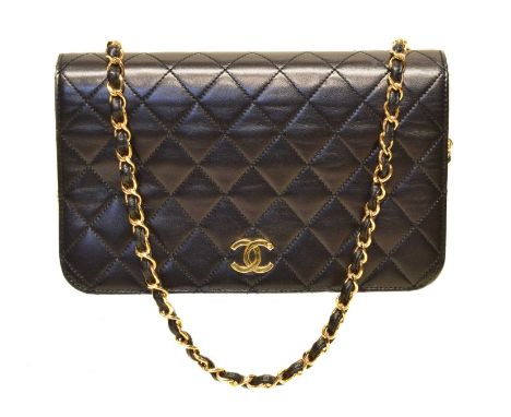 A Chanel Mademoiselle Timeless Full Flap Shoulder Bag, circa 1997-9, the black quilted calf leather exterior with interlaced 