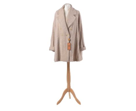 A wool coat by Fendi, the beige wool coat with double breasted buttons and oversized lapel, size 42.Condition report: Overall