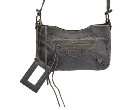 A Balenciaga Classic Hip bag, the dark grey distressed leather exterior with aged brass hardware and long shouler strap, susp
