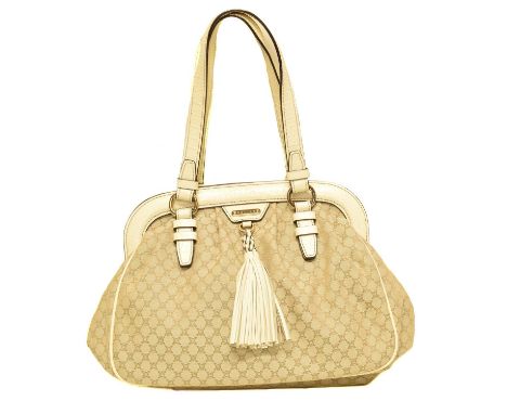 A Celine Top Handle Tote Bag, the maker's Macadam canvas exterior with white leather strap, tassel and gold tone hardware.32x