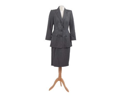 A two-piece suit by Mugler, comprising a jacket and skirt with velvet embossed texture and silver tone buttons with makers lo