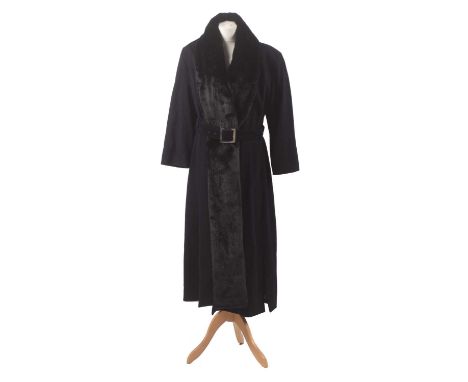 A wool coat by Mugler, the full length black wool coat with asymmetric faux fur collar and waist belt.Condition report: Overa