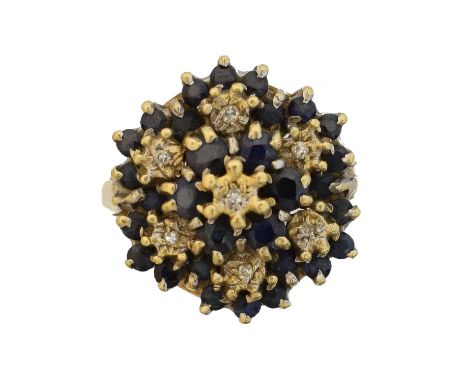 An 18ct gold sapphire and diamond cluster ring, An 18ct gold sapphire and diamond cluster ring, of tiered design, hallmarks f