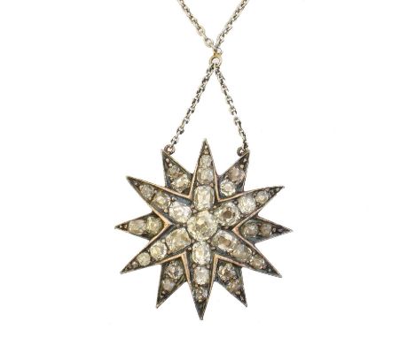 A diamond star necklace, A diamond star necklace, the old cut diamond twelve point star suspended from a trace link chain, le