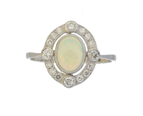 An opal and diamond cluster ring, An opal and diamond cluster ring, the oval opal cabochon within a brilliant cut diamond sur