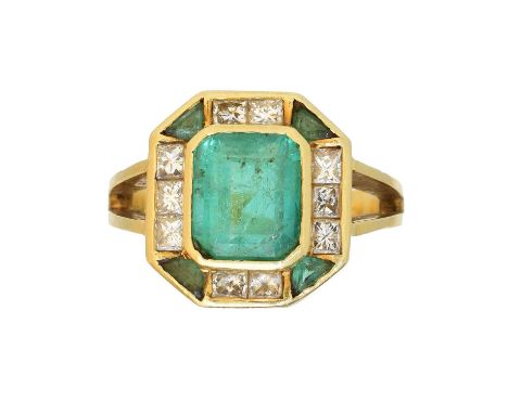 An 18ct gold emerald and diamond cluster ring, An 18ct gold emerald and diamond cluster ring, the rectangular shape emerald w