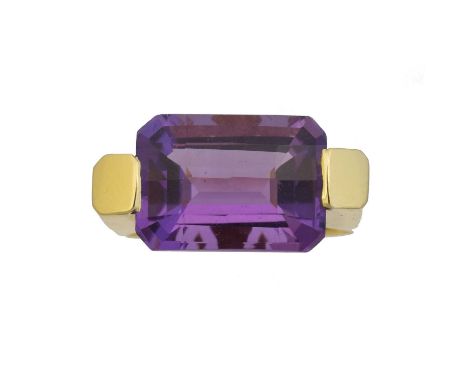 An 18ct gold amethyst single stone ring, An 18ct gold amethyst single stone ring, the fancy rectangular cut amethyst weighing