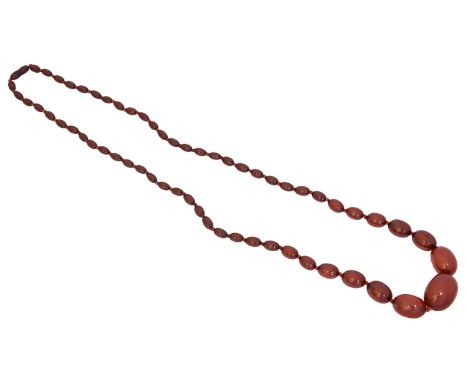 A cherry bakelite necklace, A cherry bakelite necklace, the graduated oval cherry amber bakelite beads with a screw clasp, le