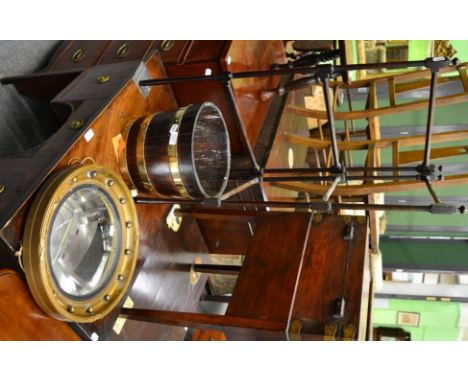 An oak brass bound bucket; a 19th century style circular convex mirror and a folding mahogany clothes rack (3)