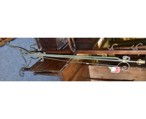 A wrought iron standard lamp