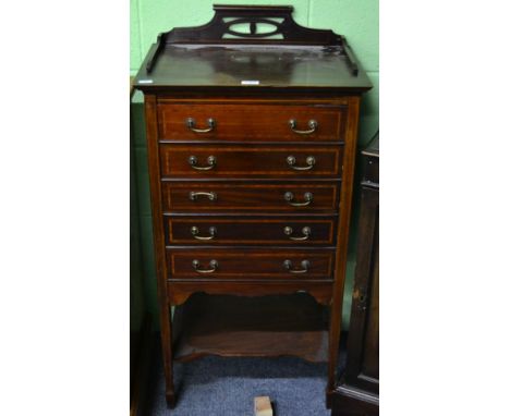 A mahogany inlaid music cabinet 