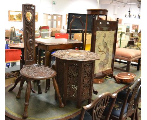 A Welsh carved oak spinning chair; an early 20th century nest of three tables and an Indian heavily carved octagonal table, E