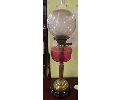 Original Victorian oil lamp with brass stem ruby glass bowl and etched football shade. 