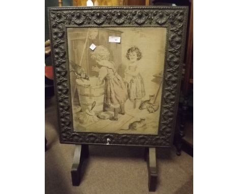 Victorian brass fire screen with wool tapestry inset panel. 