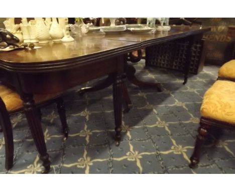 Regency mahogany economy  table the centre pod with turned column and four out swept feet.  { 256cm L X 120cm W }.