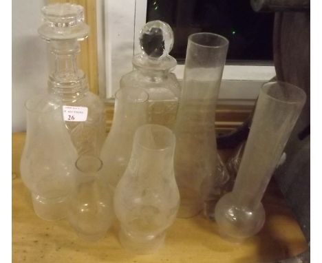 Two 19th. C. glass decanters and a collection of glass lamp chimneys. 